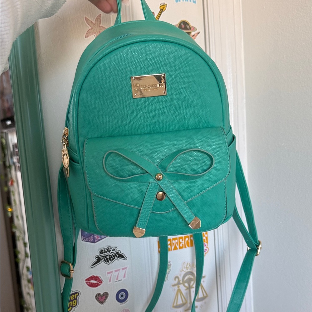 Chic Turquoise Backpack with Bow by Betsey Johnson